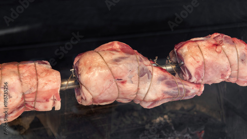 Cooking meat on a spit.