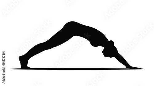Woman practicing yoga in downward dog pose silhouette