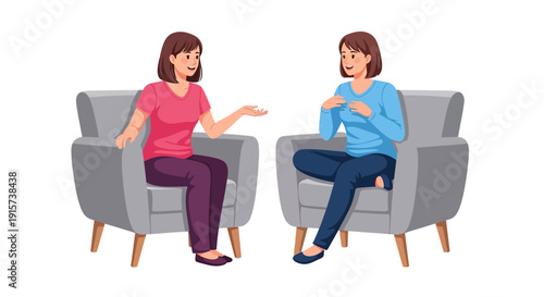 Two women engaged in a conversation while seated in gray armchairs facing each other comfortably indoors