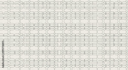 A large, intricate grid pattern is visible on a light surface, viewed from directly above the detailed design.