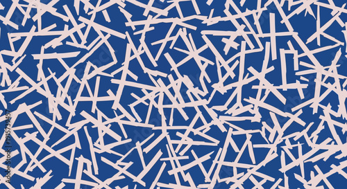 Geometric shapes scattered across a blue background viewed from directly above in a chaotic pattern