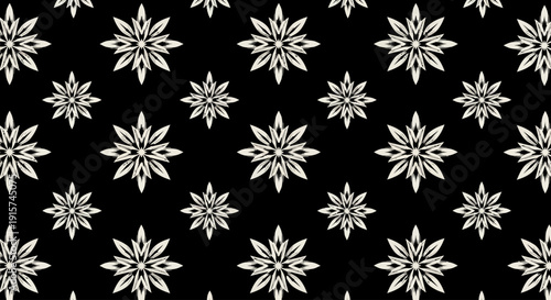 A collection of white snowflakes on a black background viewed from directly above, showcasing intricate designs and patterns