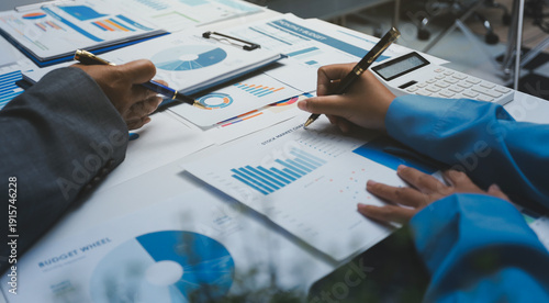 Auditor and accountant team working in office, analyze financial data and accounting record with calculator. Accounting company provide finance and taxation planning for profitable cash flow.