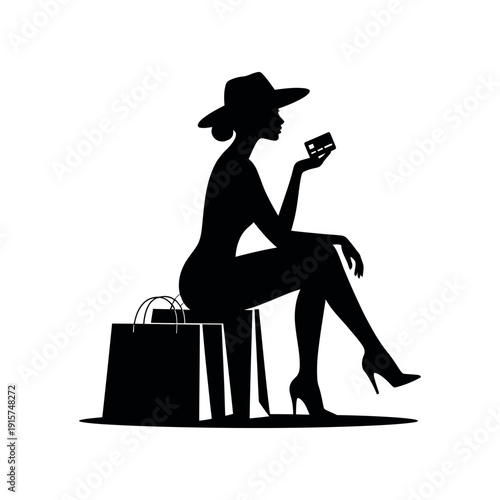 A woman in silhouette sitting with shopping bags and holding a credit card