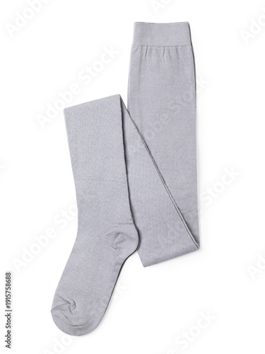 New folded gray children's tights, isolated on a white background, top view. Genuine photo, not generated by AI