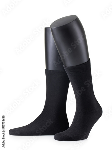 Black classic socks on a mannequin, isolated on a white background. Genuine photo, not generated by AI