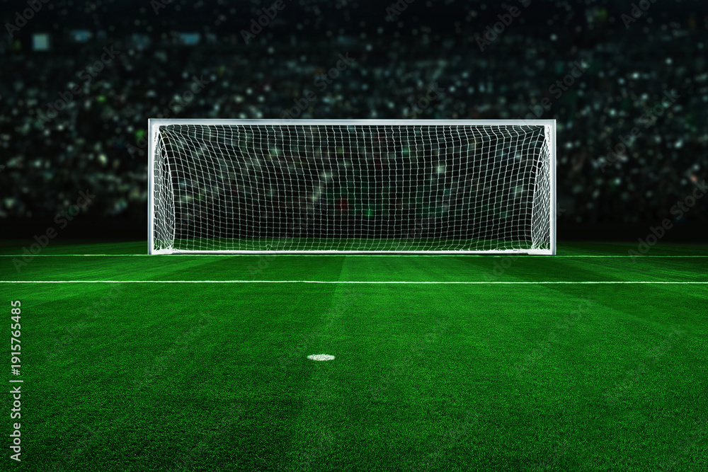 Fototapeta premium Empty soccer goal on a vibrant green field under bright stadium lights. Dramatic night atmosphere with a blurred crowd background, perfect for sports marketing, competition, and goal-setting concepts.