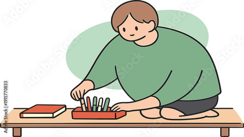 Soft person kneels by a low desk placing pens into a tray while a notebook lies closed nearby. | organizing pens desk, flat