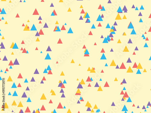 Playful scattering of colorful triangles on a soft yellow background