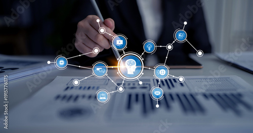 Tableau sur toile A businessman engages with advanced technology, incorporating artificial intelligence elements and data analysis tools in a modern office setting