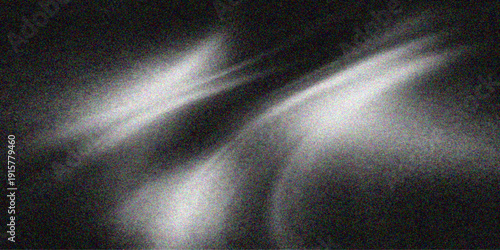 Smooth blue wave patterns glow against a dark black backdrop as a spotlight creates a blurred smoke texture for this abstract night wallpaper design