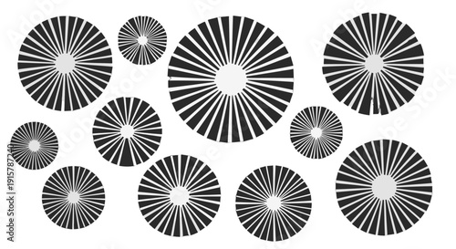 Collection of black and white radial pattern circular shapes.