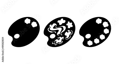 Three black artist palettes with different paint arrangements on a white background
