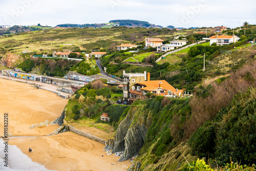 Rocky coastline and sandy beach with cliffs and ocean waves. High quality photo