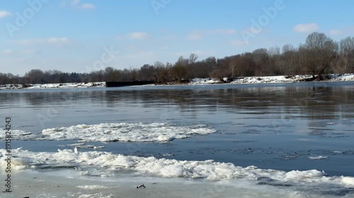 Narew River in winter, close-up of floating ice floes.