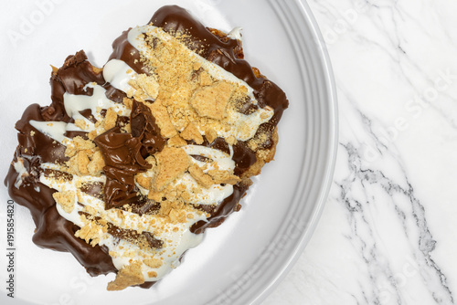 Cinnamon Donut Covered in Dark Chocolate with Vanilla Glaze  Graham Craker and Melted Chocolate Bar