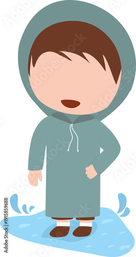 Boy standing in rain puddle