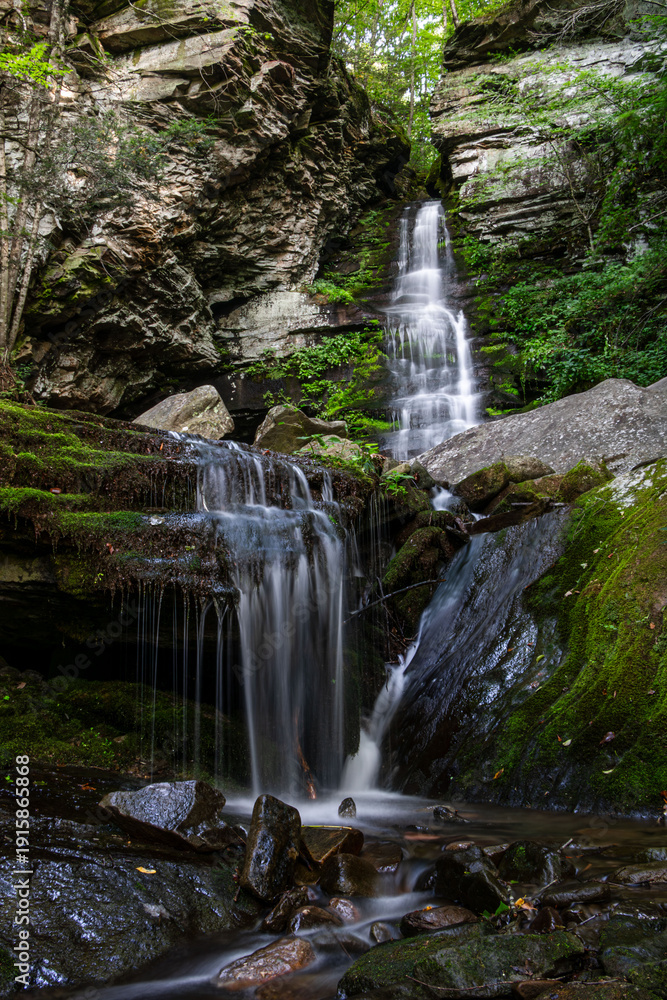 Fototapeta premium little waterfall cascade slow motion falling water