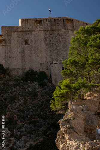 Photography Exterior view of the ancient stone defensive walls in Dubrovnik, impressive medi