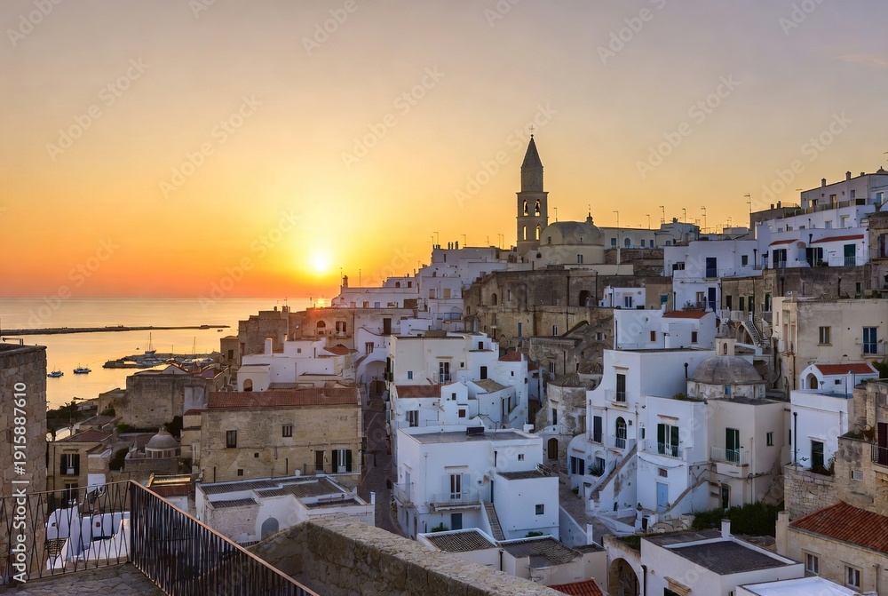 Fototapeta premium Golden hour magic over a historic whitewashed village cascading to the mediterranean sea