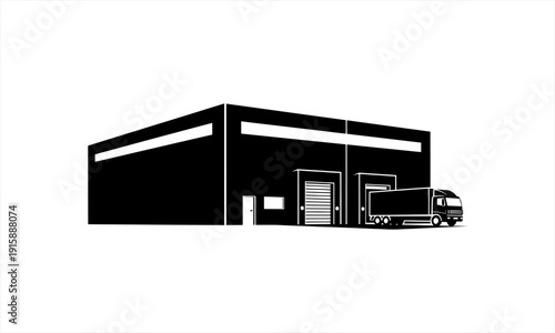 Industrial warehouse building with a delivery truck parked outside.