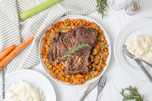 Fotografie Hearty American food. Beef pot roast with roasted veggies