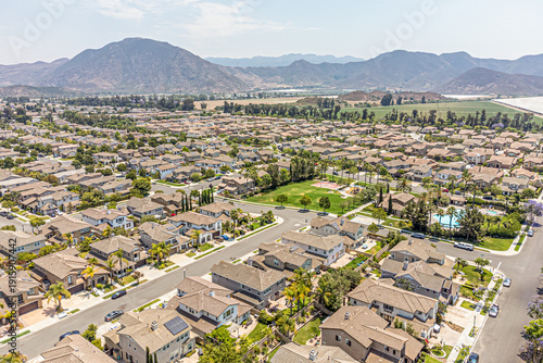 Camarillo, California – July 11, 2024: Aerial Drone Camarillo City View Photo toward Pleasant Valley Rd with House, Home, Town, Street, Road, Cityscape, Townhouse, Townhome, Mountain
