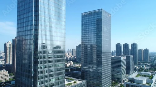 Wallpaper Mural Aerial view of several glass skyscrapers in a cityscape under a clear blue sky, buildings Torontodigital.ca