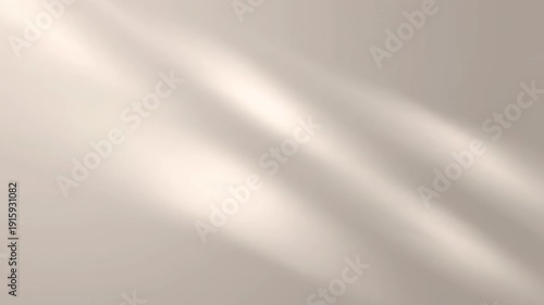 Dynamic abstract light rays and soft shadows slowly moving across a textured beige wall surface, creating a calming background.