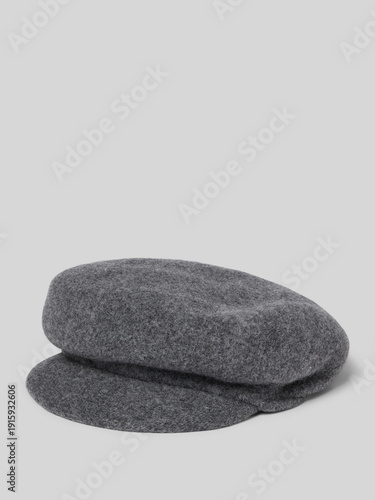 A close up view of two dark gray oval shaped stones or rocks with textured surfaces