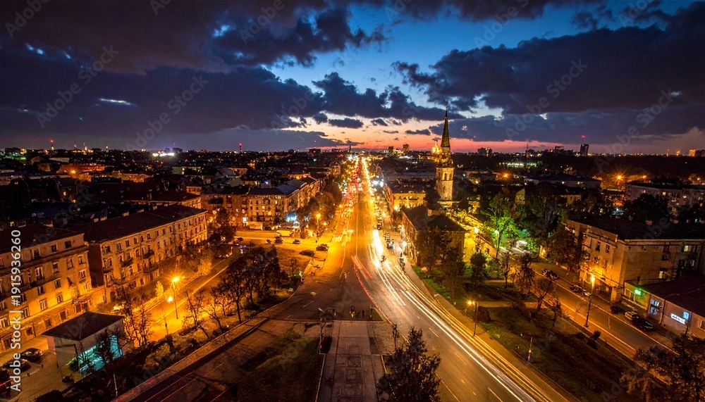Fototapeta premium Cityscape Night View with Illuminated Buildings.
