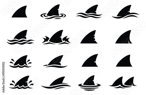 Graphic shark fin silhouettes set featuring various designs and poses in water for marine life and danger concepts
