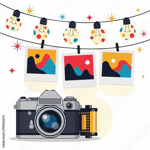 Vintage camera and photos hanging on a string with lights.