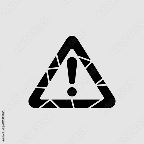 Black and white triangular warning sign with exclamation mark inside triangle