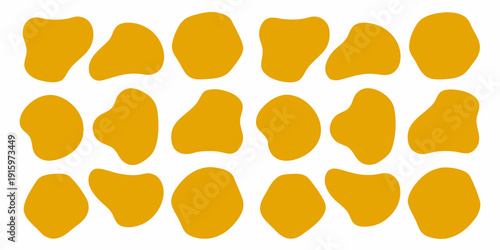 Abstract arrangement of irregular golden yellow shapes on a white background