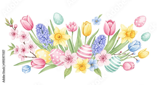 Beautiful Easter floral arrangement with colorful painted eggs and blooming spring flowers such as tulips and daffodils