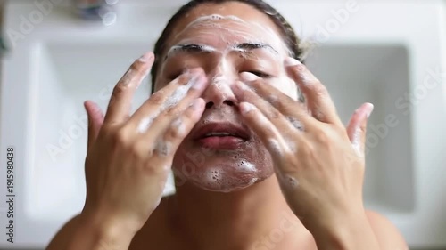 Woman Washing Face with Cleansing Foam.