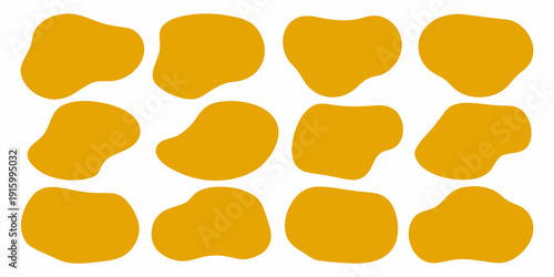 Abstract arrangement of irregular golden yellow shapes on a white background