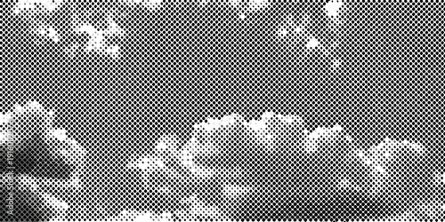 Abstract grayscale image depicting a textured surface with cloud like formations and scattered dots