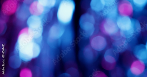 Blur circles. Neon color light. Blue purple pink round shiny texture glimmer optical illuminated flare on art abstract bokeh background.