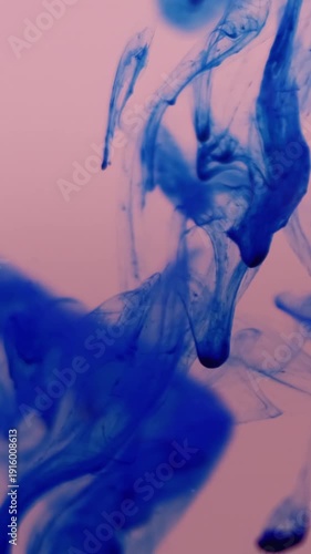 Vertical video. Ink shot. Smoke swirl. Blue pigment dripping color water blur vapor splash mix. Art mist dye blob abstract liquid background stream.