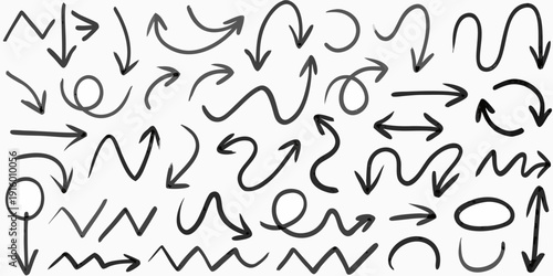 Collection of hand drawn arrows in various shapes and directions black and white