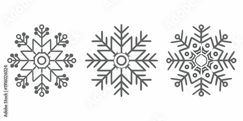 Three detailed black and white snowflake illustrations arranged in a row against a white background