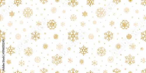 Golden snowflakes on a white background create a wintery festive pattern