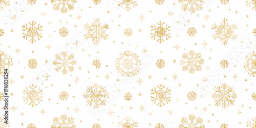 Golden snowflakes scattered across a bright white background create a festive pattern