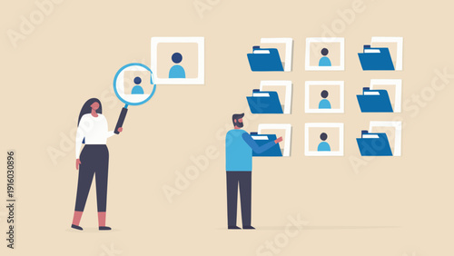 Team reviewing candidate profiles and digital files using modern technology