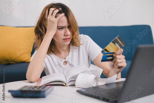 Stressed young woman worried about credit card debt while holding multiple cards and bills, representing financial pressure, overspending, debt management, and money problems.