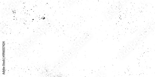 Distressed white grunge texture with black grit and grainy noise vintage weathered featuring a white background with sparse black distressed elements.