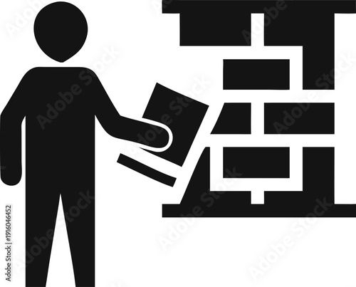 Individual engaged in constructing a building block wall, symbolizing growth and development