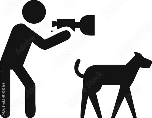 Professional photographer standing to capture a memorable portrait of a domestic dog